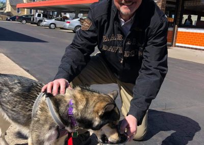 Gary Rudy with dog drinking water