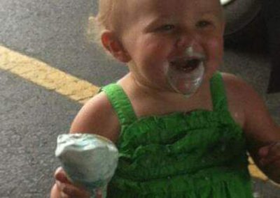 Smiling toddler with ice cream